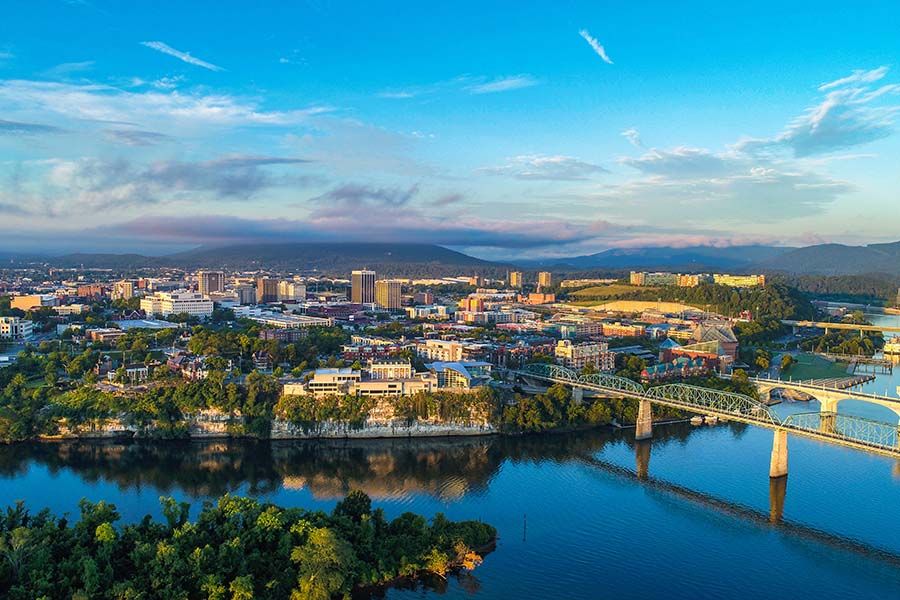 Contact - Aerial View of City of Chattanooga Tennessee and Surrounding Lake and Bridges Against Blue Sky