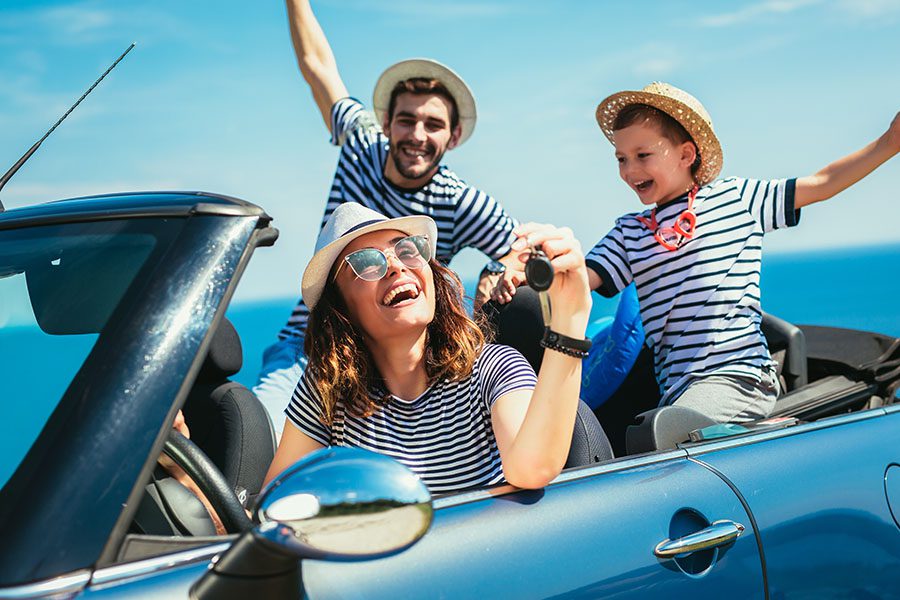 Personal Insurance - View of Cheerful Family Going on a Road Trip for Summer Vacation